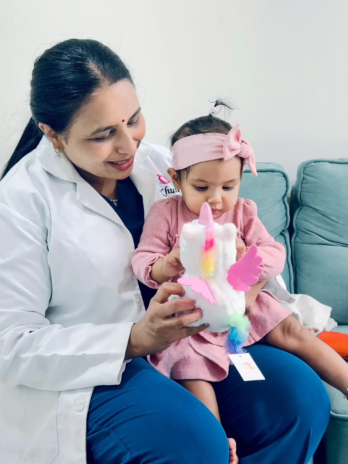 Dr Rashmi Yogish sharing a moment with a child at Khushi Fertility & IVF Centre
