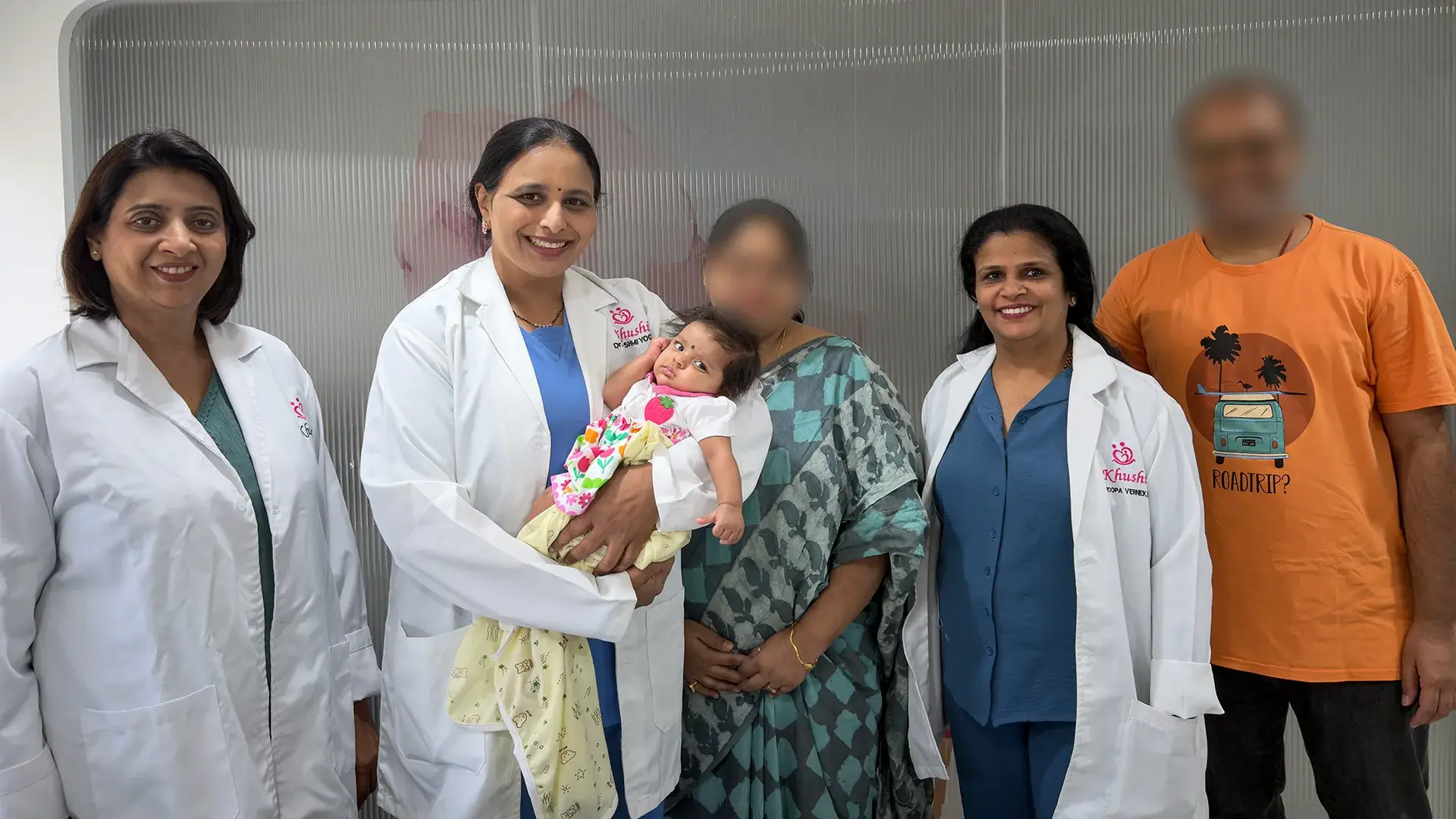 Dr Rashmi Yogish with clinical team, family and baby at Khushi Fertility & IVF Centre